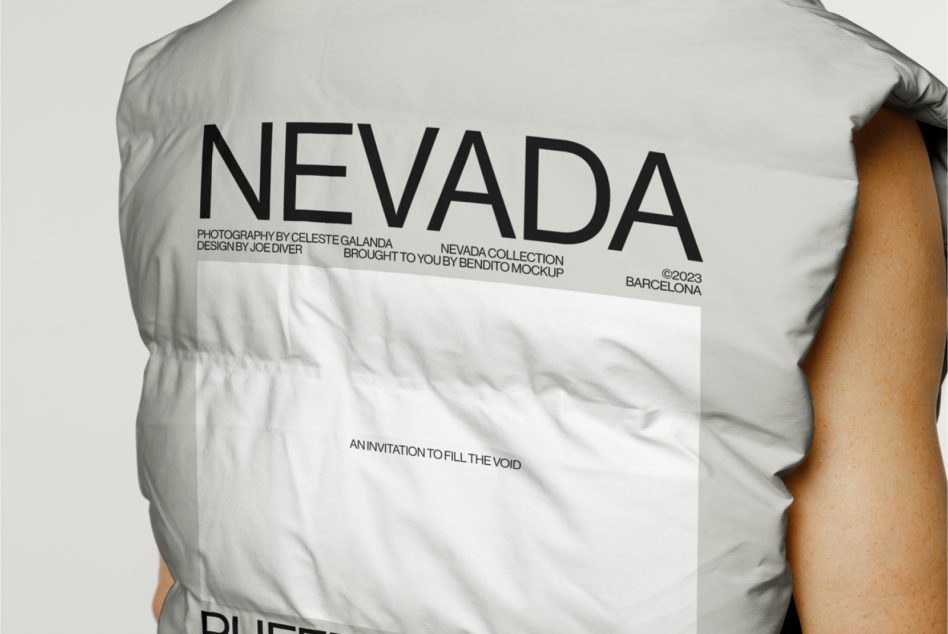 Side profile of white puffy vest showing Nevada branding across chest area
