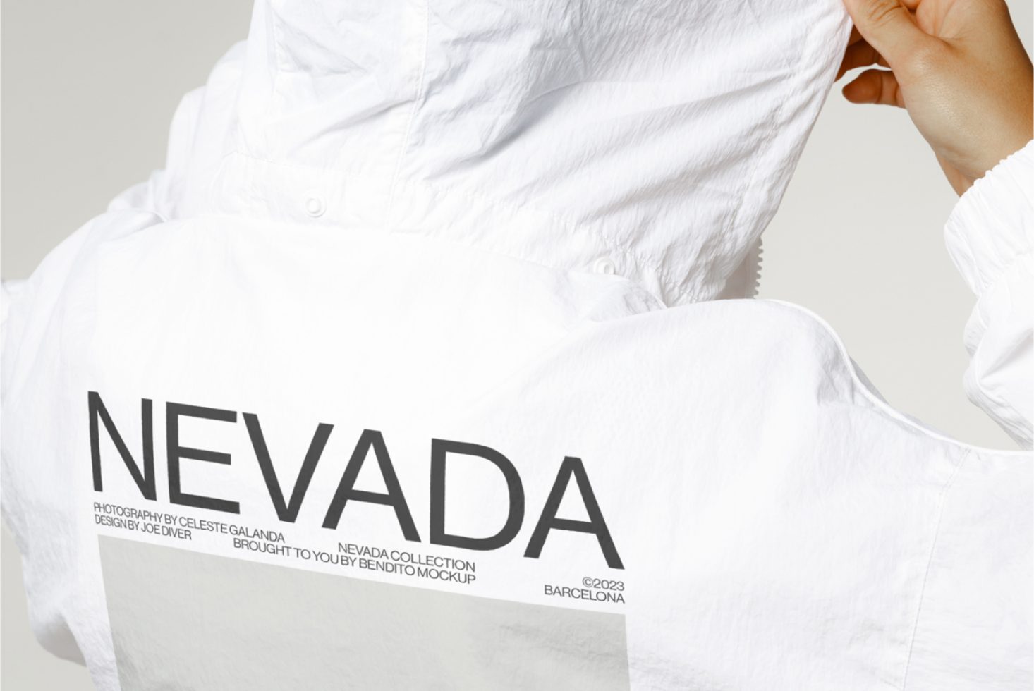 Close-up of a white shirt mockup with black 'NEVADA' text design, ideal for apparel presentation, digital assets for fashion designers.