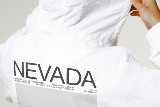 Close-up of a white shirt mockup with black 'NEVADA' text design, ideal for apparel presentation, digital assets for fashion designers.
