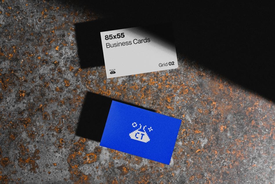 White business card with black text, blue card with beige pixelated logo below