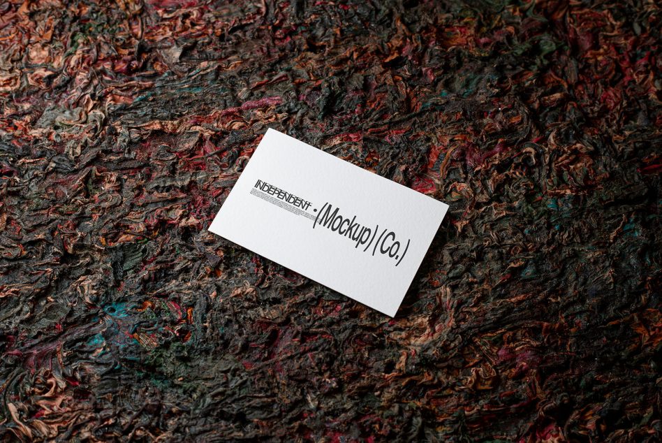 White business card on colorful orange red textured bark background