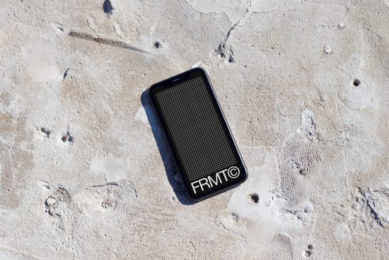 Smartphone mockup on textured concrete background, ideal for showcasing UI/UX designs, digital assets, sleek modern design presentation.