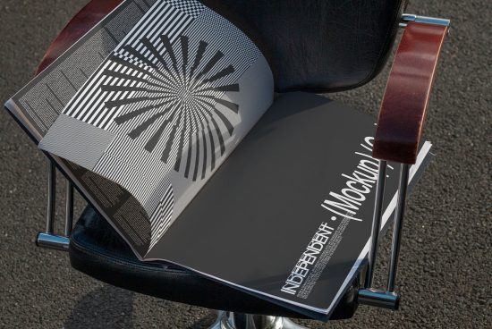 Magazine mockup on modern chair showcasing geometric pattern design, ideal for presentations and portfolio display for designers.