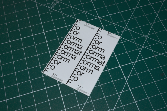 Printed typography design template with progressive scale showcasing font styles on a cutting mat for design asset marketplace.