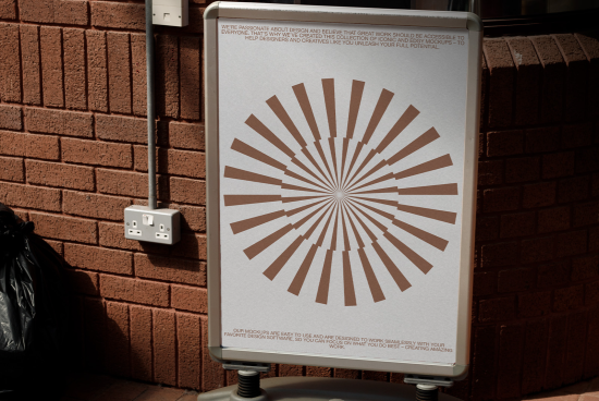 Outdoor poster mockup on a metal stand displaying a radial design against a brick wall, ideal for designers' presentations.