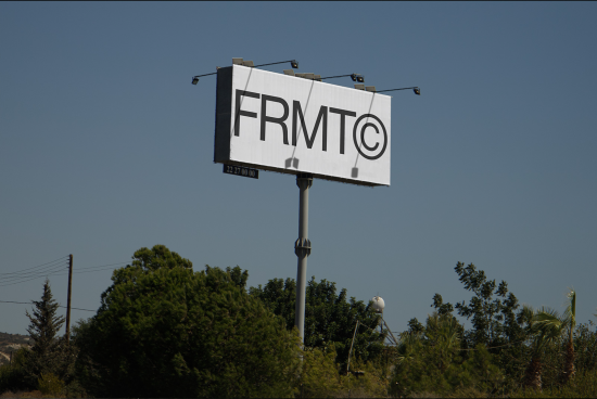Billboard mockup with clear sky background and bold FRMT© logo, ideal for outdoor advertising designs, graphic presentations, and marketing.