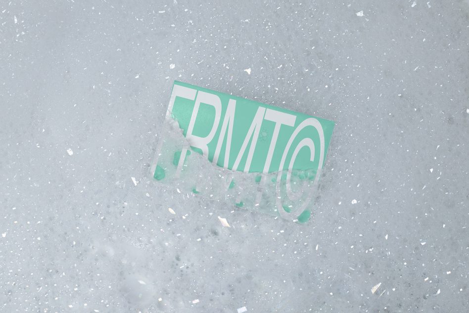 Mint green transparent business card mockup on white speckled concrete surface