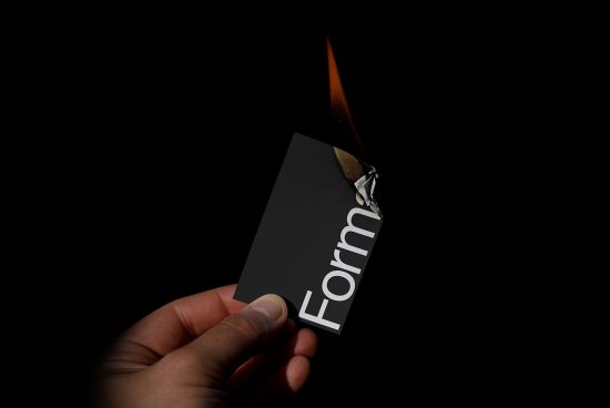 Creative business card mockup with realistic flame effect, showcasing elegant typography and design on a dark background.