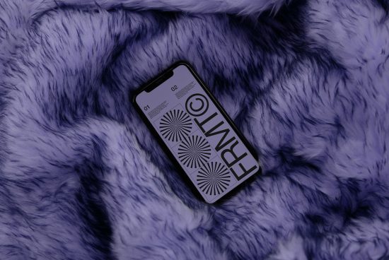 Smartphone mockup on purple fur surface displaying bold graphic design, ideal for showcasing app interfaces or branding designs to clients.