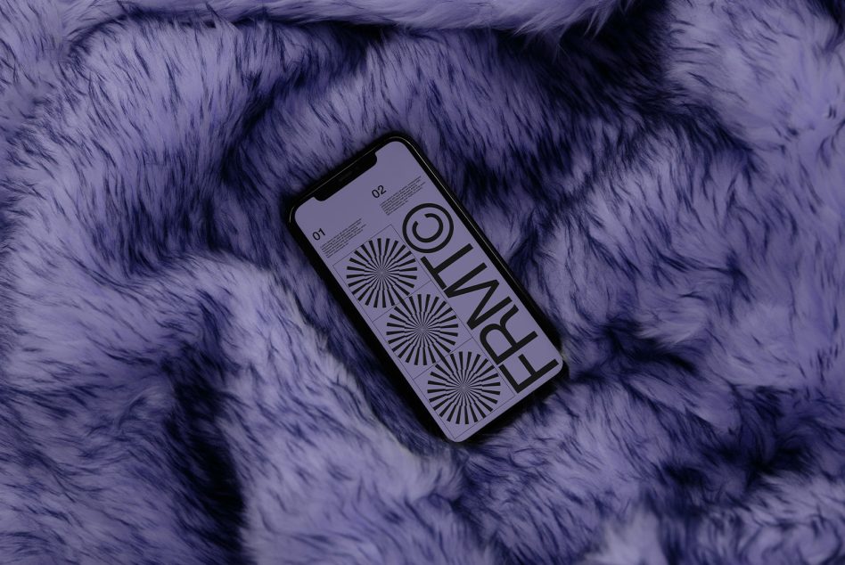 Phone mockup with FRNWL portfolio on lavender fur fabric surface