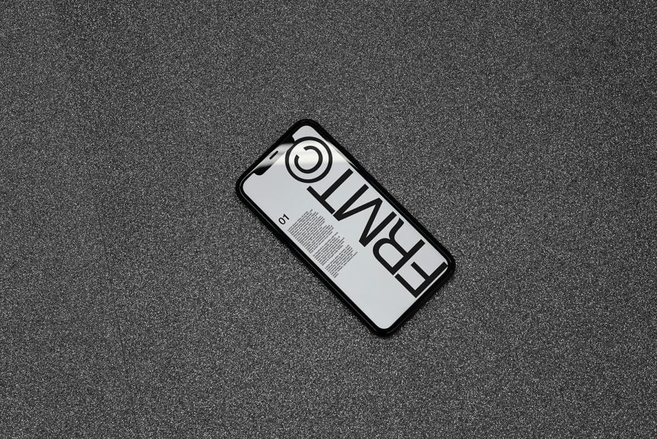 Smartphone mockup showing vertical layout with bold typography on textured background
