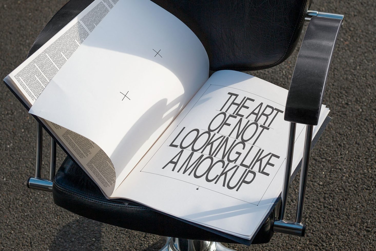 Open book on chair displaying bold typography design, perfect for mockup and graphic design inspiration for designers.