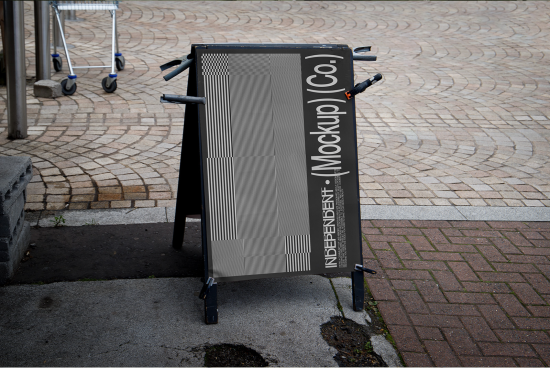 Outdoor sandwich board sign mockup on a cobblestone pavement for showcasing branding and design projects to clients and on portfolios.