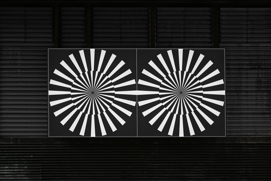 Graphic design mockup of two concentric circle line posters in high contrast black and white, displayed against a metal slat background.