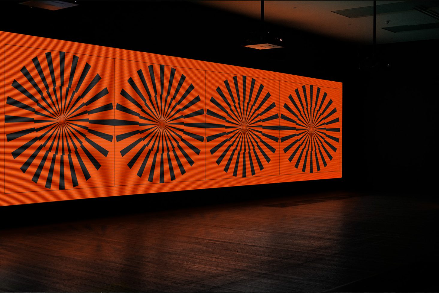 Digital screen display with vibrant orange radial patterns mockup, ideal for dynamic graphics in a modern interior setting.