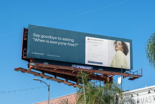 Billboard design with calendar app advertisement, blue sky background, suitable for template and mockup category, high-quality image for design asset.