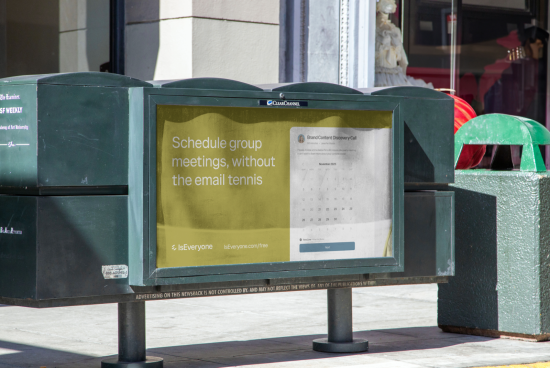 Outdoor bus stop billboard mockup in an urban setting displaying an advertisement with clear text and calendar graphic for realistic presentation.