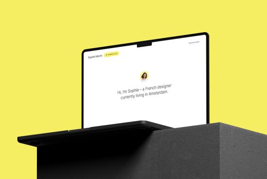 Laptop on a stand showing a personal portfolio website page, minimalist design, mockup for web designers, yellow background with copyspace.