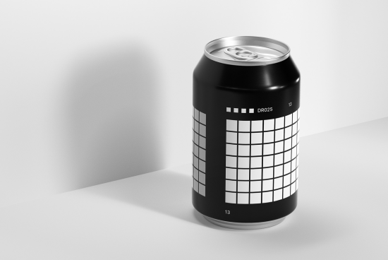 Photorealistic soda can mockup with a grid pattern design, standing on a white surface, showcasing shadows and lighting, ideal for product presentation.