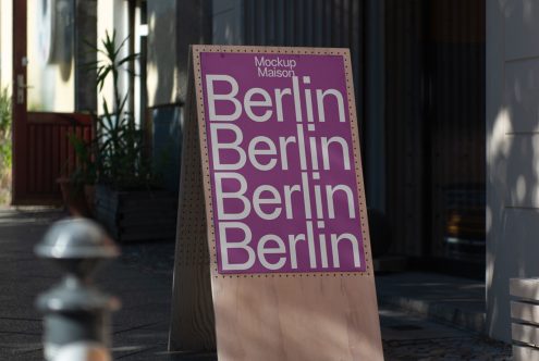 Street view of a sandwich board mockup featuring bold typography design, suitable for graphic designers looking for urban mockups.