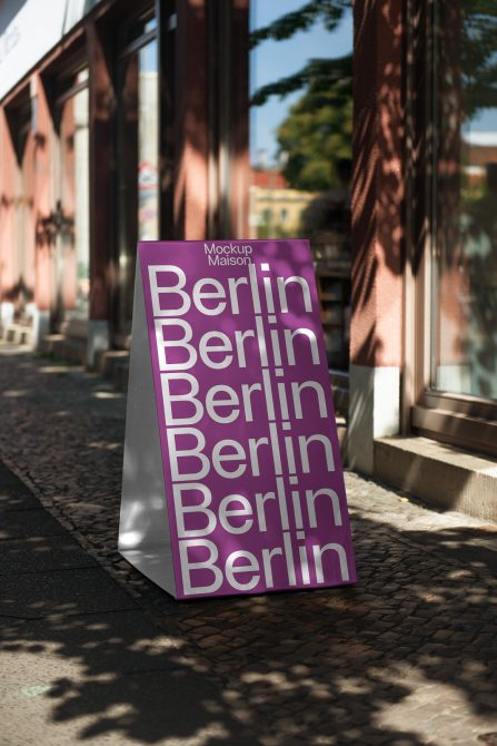 Magenta folded sign with layered Berlin text in minimalist sans-serif font