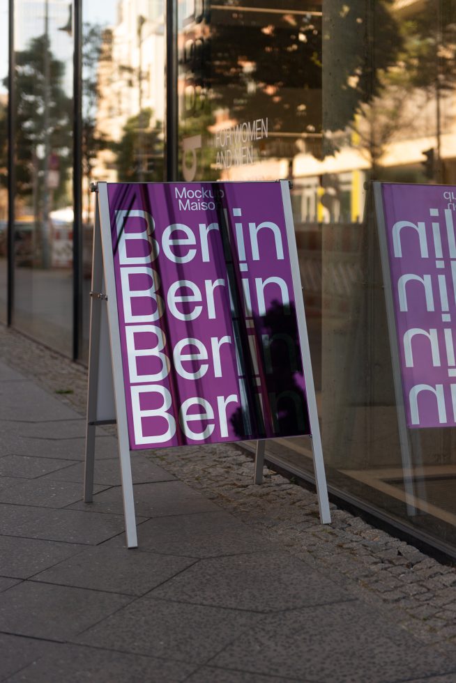 Urban street sandwich board mockup with purple poster featuring text design city name, ideal for showcasing marketing graphics and fonts.