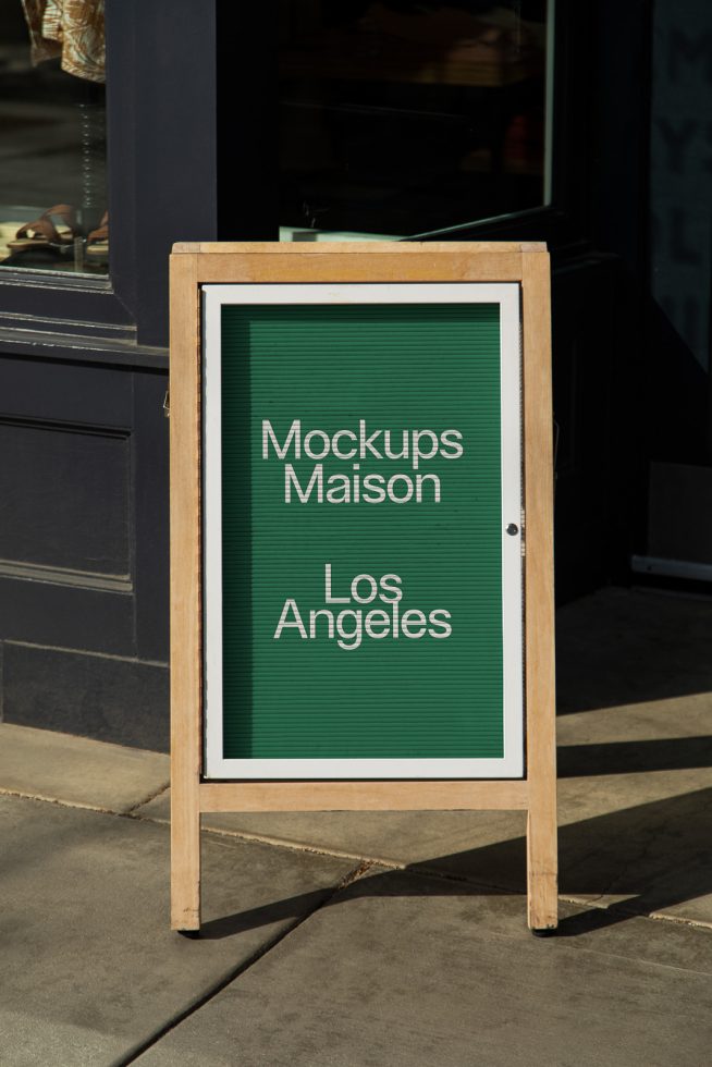 Outdoor advertising mockup featuring a wooden A-frame sidewalk sign with customizable text space, ideal for designers creating brand presentations.