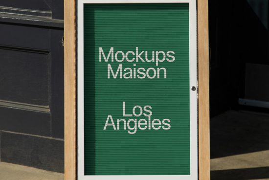 Street signboard mockup with elegant sans-serif typography showcasing the words Mockups Maison Los Angeles on a green slatted background.