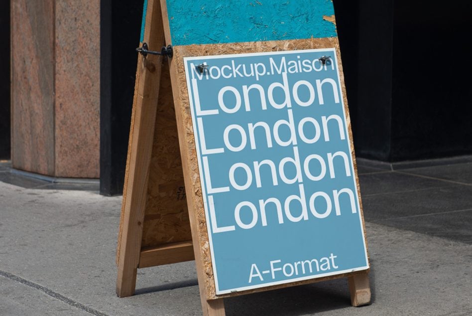 Close-up of blue A-format poster on wood sign with repeated London text