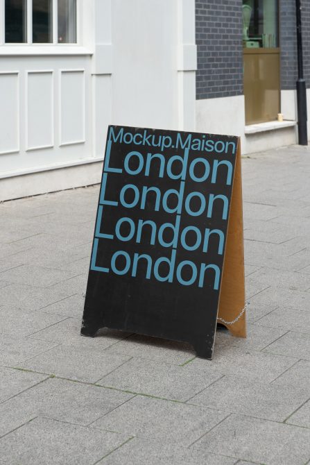 A-frame signboard mockup with repetitive 'London' text on sidewalk for outdoor advertising and display design presentations.