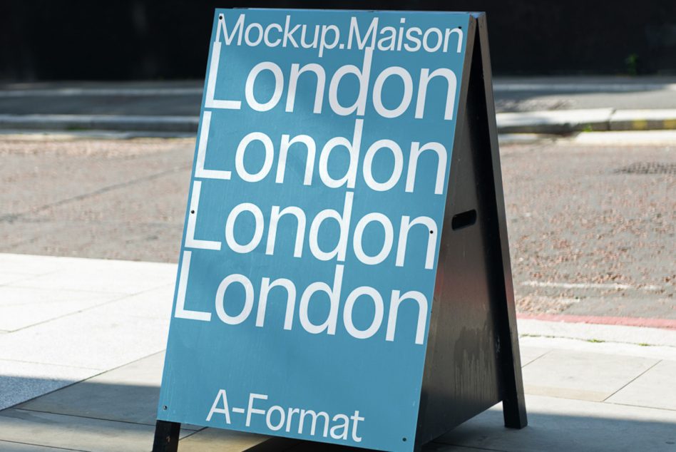 Blue A-frame street sign with light text saying London multiple times