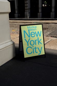 Sidewalk sandwich board with lime background, blue typography