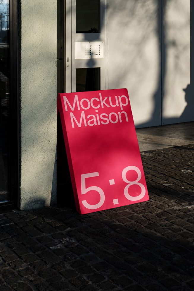 Outdoor advertising mockup display standing on pavement with shadows, bold pink design with text Mockup Maison for print template.