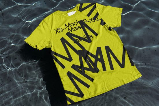 Yellow t-shirt mockup with black text design floating on water surface, realistic texture, apparel presentation, designer asset.