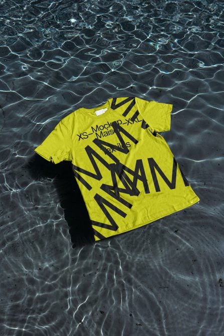 Neon yellow oversized shirt with black diagonal stripes on water