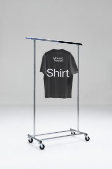 Black tee on rolling rack with two-tone bar showing back design