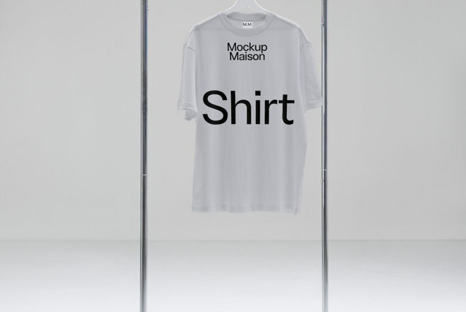 White t-shirt mockup on hanger in a neutral setting for design presentation, ideal for graphics and apparel designers.