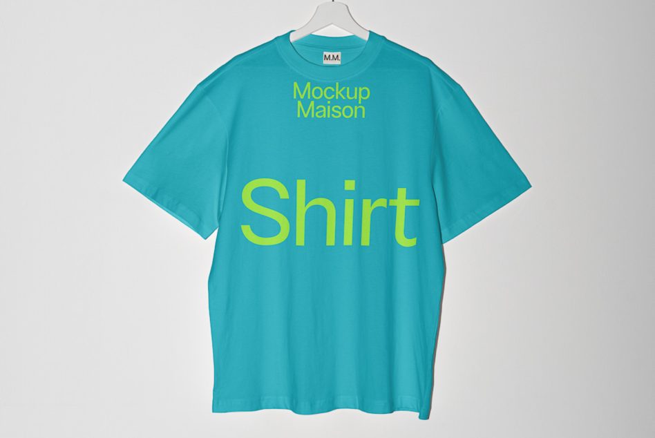 Oversized turquoise shirt on hanger with neon yellow text