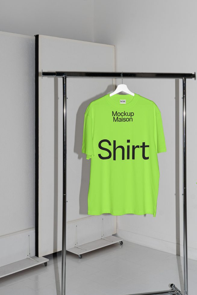 Neon green t-shirt mockup on hanger in a minimalist setting for graphic design, ideal for showcasing apparel designs and patterns.