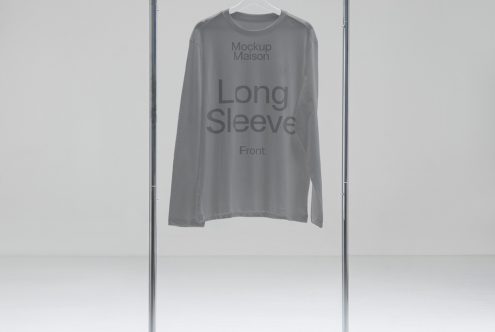 Minimal long sleeve shirt mockup on hanger in a neutral setting, ideal for showcasing apparel designs and patterns for fashion designers.