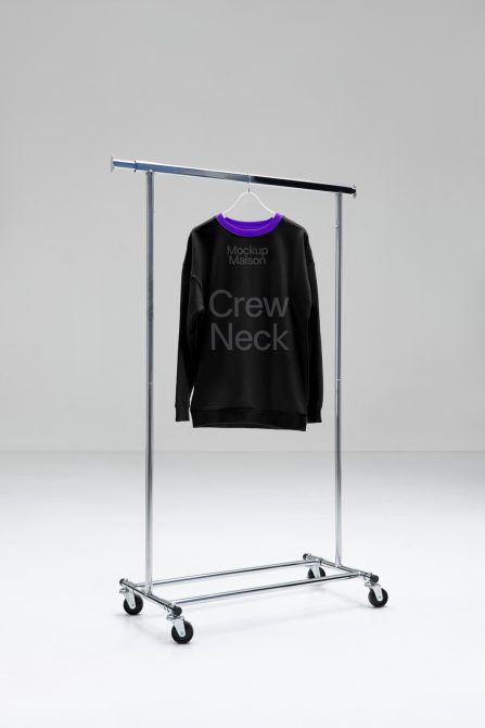 Black crew neck sweatshirt on hanger rack mockup, simple design for branding and apparel presentation, isolated on a clean background.