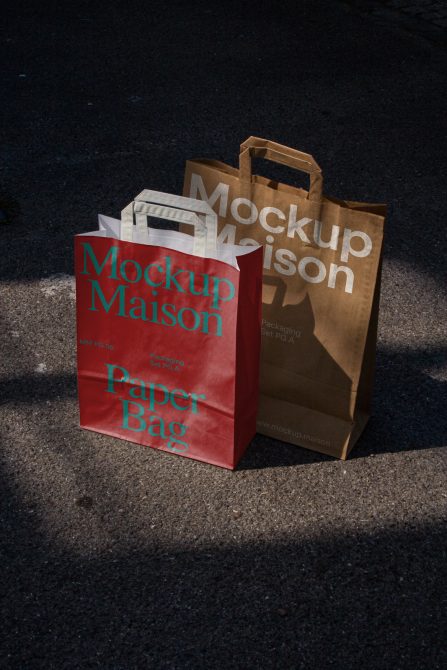 Paper bag mockups in red and brown with elegant design, shadow overlay effect, featured in outdoor lighting—ideal for presentations and branding.