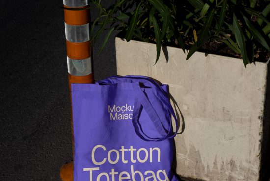 Purple cotton tote bag mockup against urban background, ideal for showcasing design work, branding mockups, designer assets, creative visuals.