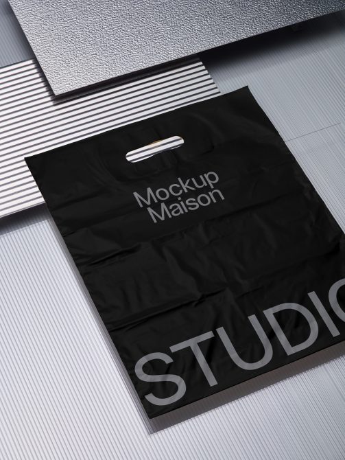 Black shopping bag mockup with stylish embossed textures, ideal for designers to display branding designs on a realistic background.