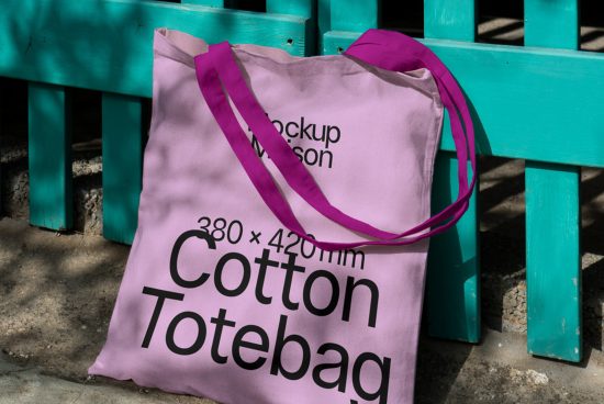 Lavender cotton tote bag mockup with dimensions displayed resting against teal bench, outdoor setting ideal for realistic product display.
