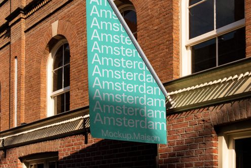 Outdoor banner mockup with repetitive text 'Amsterdam' displayed on building facade, clear sky, for graphic designers, advertising mockups.