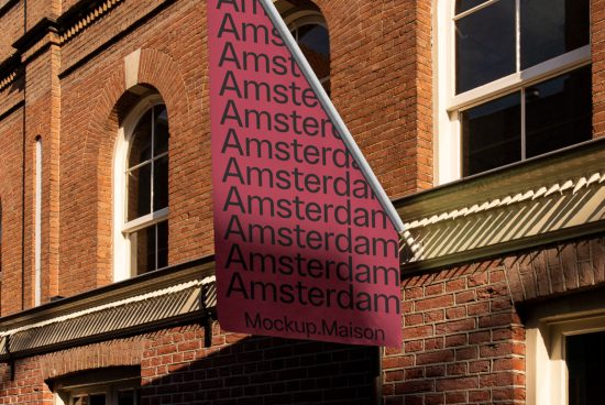 Urban banner mockup hanging on building facade showcasing repetitive text 'Amsterdam' for graphic design presentation.