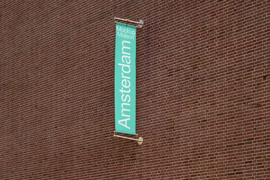 Vertical banner mockup on a brick wall with the text Amsterdam, ideal for urban-themed graphic design presentations.
