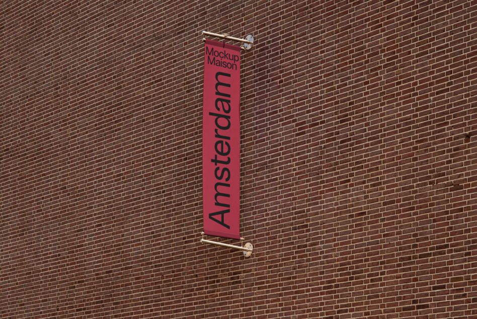 Vertical red banner on brick facade displaying Amsterdam in white