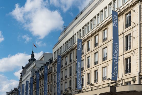 Parisian building facade with multiple banners mockups for branding, clear blue sky background, graphic design template.